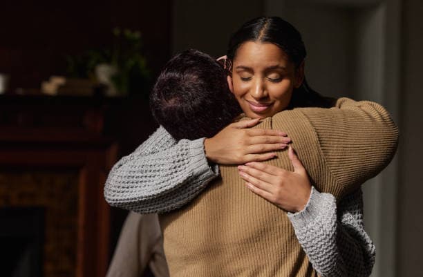 Two people sharing a warm embrace